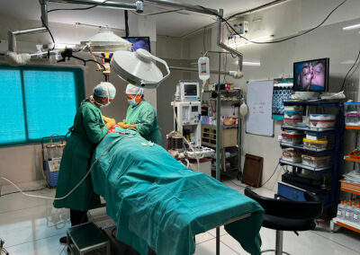 Surgical team performing a rhinoplasty in a well-equipped operating room.